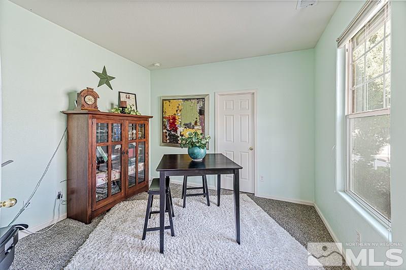 10442 Rockport Lane Reno, NV 89521 - Photo 4 of 17 a view of a livingroom with furniture window and wooden floor