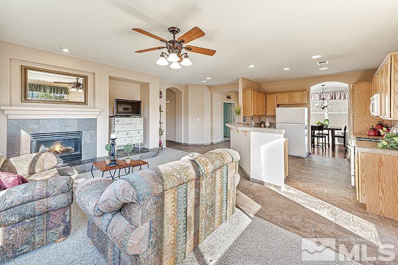 10442 Rockport Lane Reno, NV 89521 - Photo 7 of 17 a living room with furniture and a fireplace