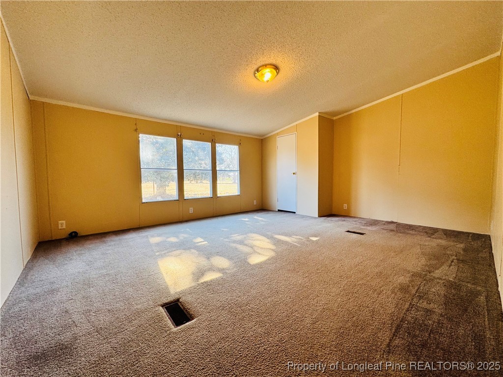 2475 Dunn Road Eastover, NC 28312 - Photo 13 of 17 a view of an empty room with a window