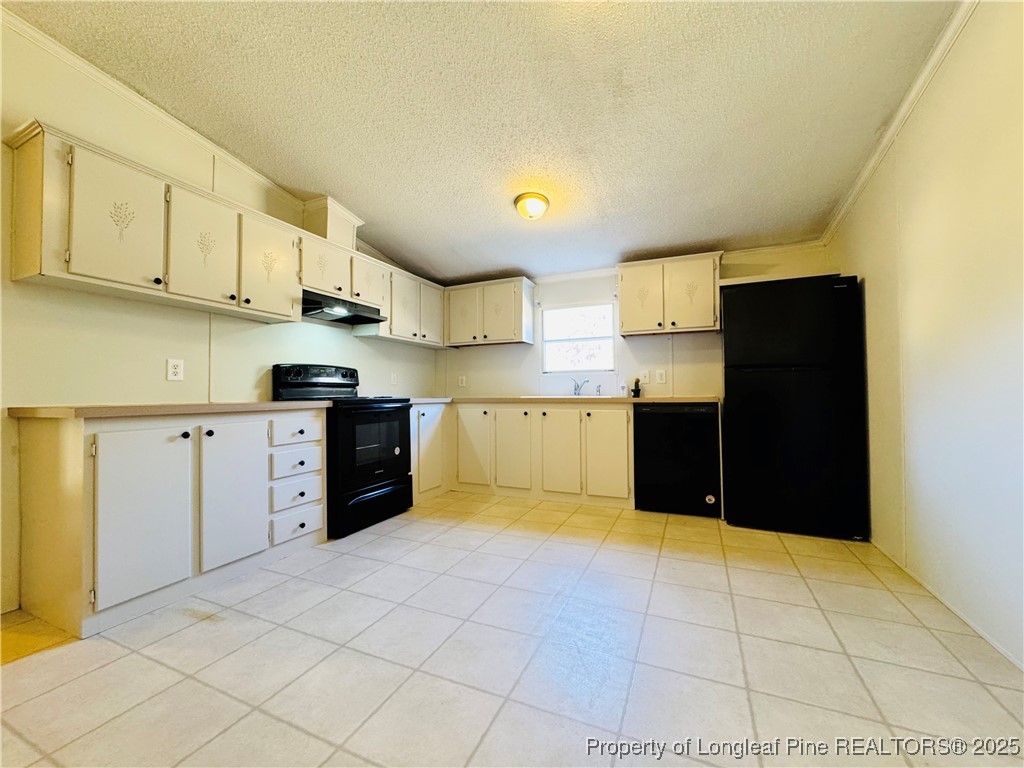 2475 Dunn Road Eastover, NC 28312 - Photo 4 of 17 a kitchen with stainless steel appliances granite countertop a refrigerator and a stove top oven