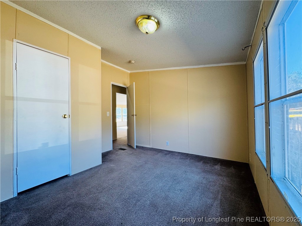 2475 Dunn Road Eastover, NC 28312 - Photo 8 of 17 a view of an empty room with a window