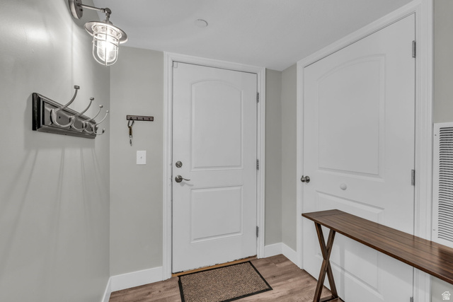905 South Main Street, Unit G Layton, UT 84041 - Photo 2 of 36 Foyer entrance featuring light wood-style floors and baseboards