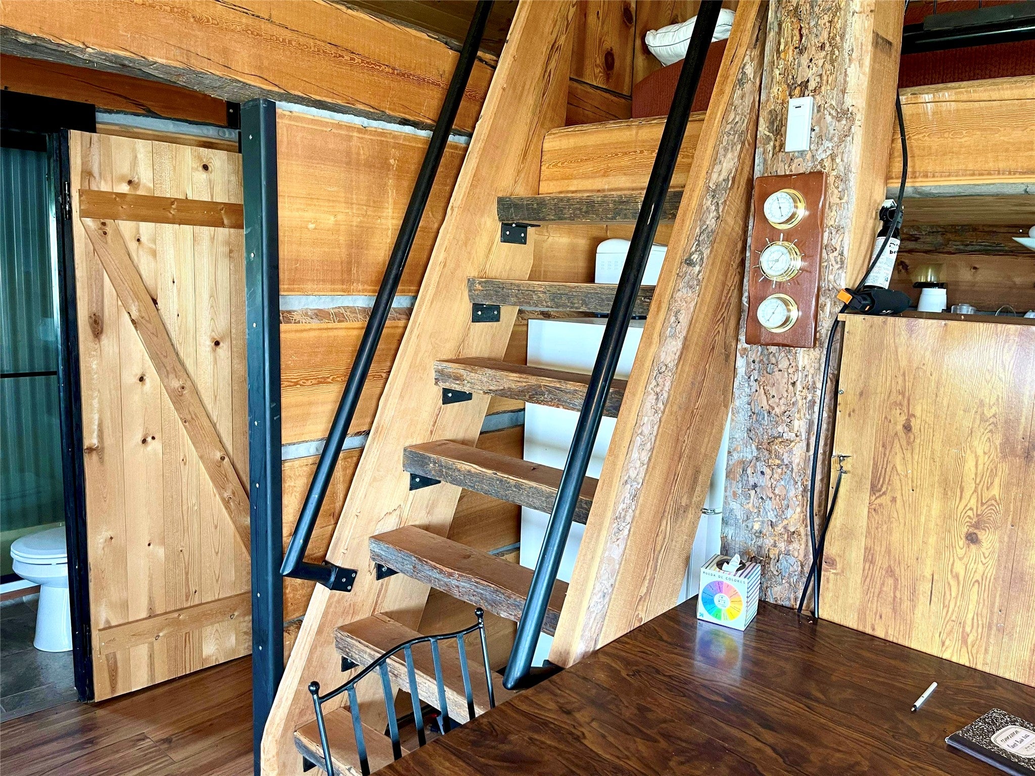 36 South Shore Road Babb, MT 59411 - Photo 9 of 21 Stairs featuring wood finished floors and a barn door