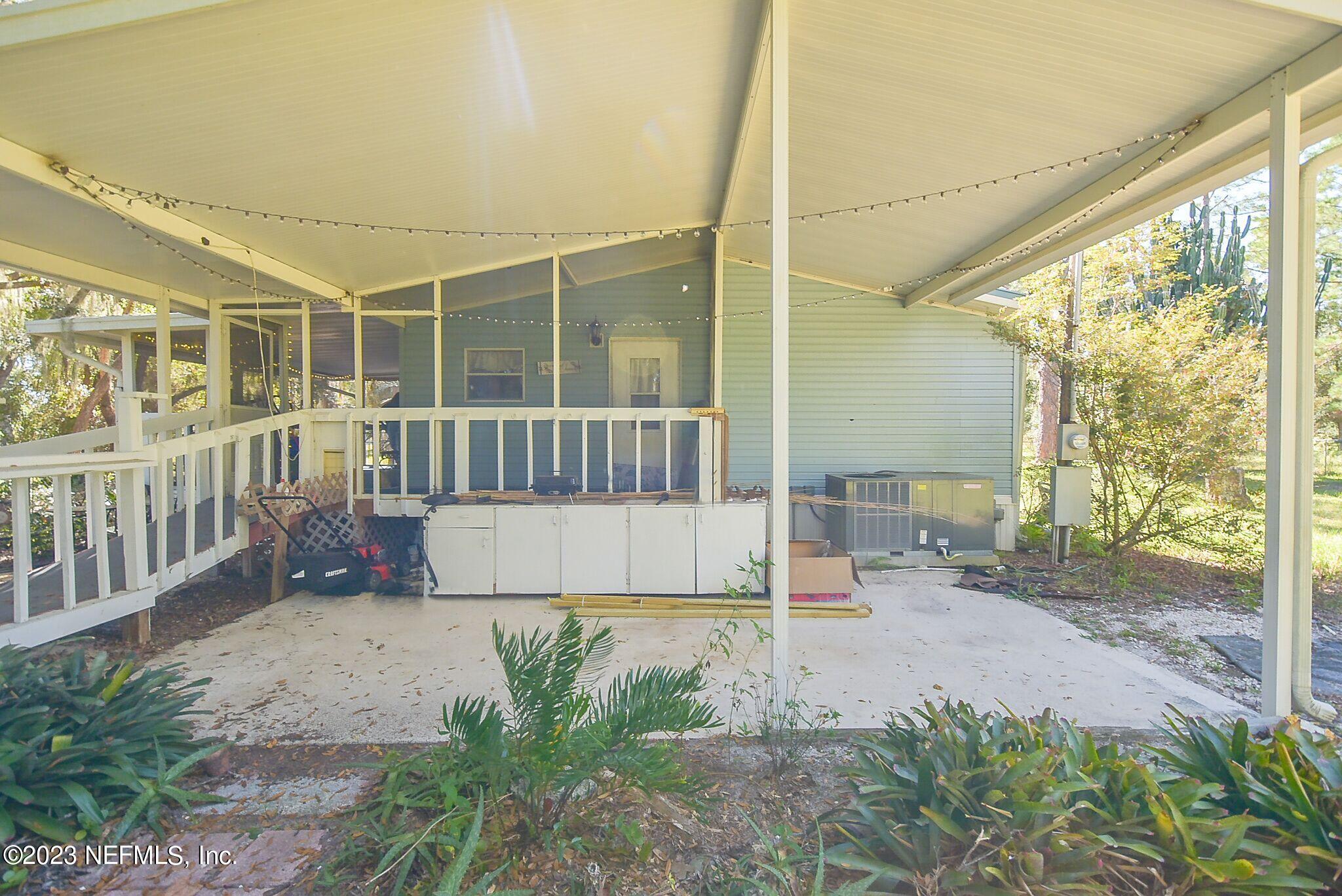 136 Lawrence Lane Georgetown, FL 32139 - Photo 22 of 33 a view of a chair and table in the patio
