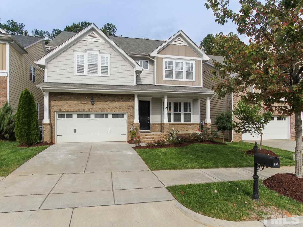 932 Chapanoke Road Raleigh, NC 27603 - Photo 1 of 25 a front view of a house with a garden and trees