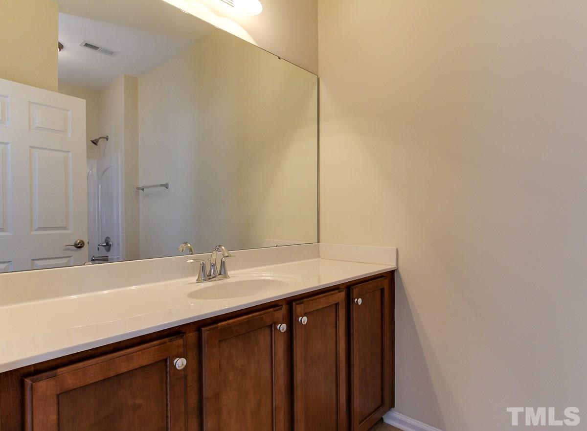 932 Chapanoke Road Raleigh, NC 27603 - Photo 20 of 25 a sink with a mirror