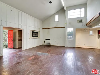 a view of entryway with wooden floor and stairs