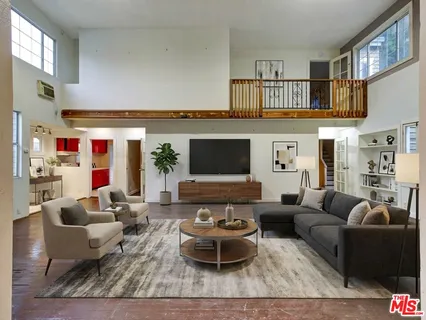 a view of a room that has a large window