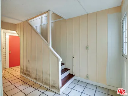 a view of an empty room with windows