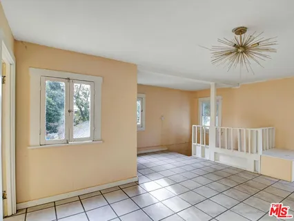 a view of a backyard of the house