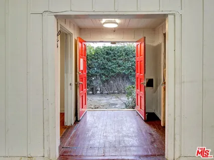 a view of a livingroom with an empty space and window