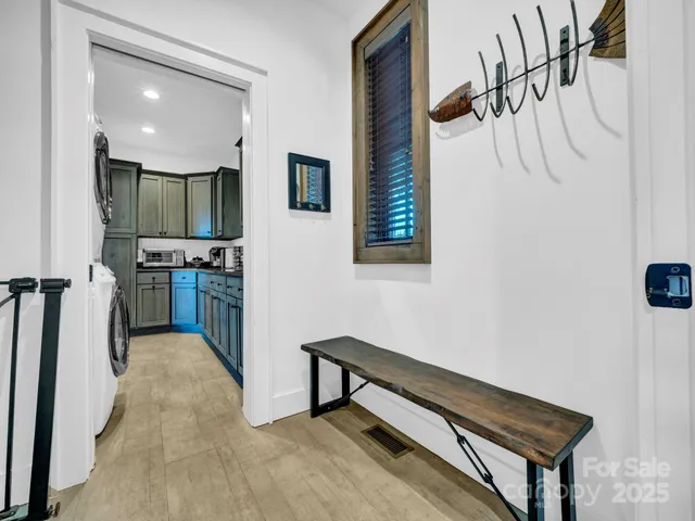 a view of a hallway with furniture