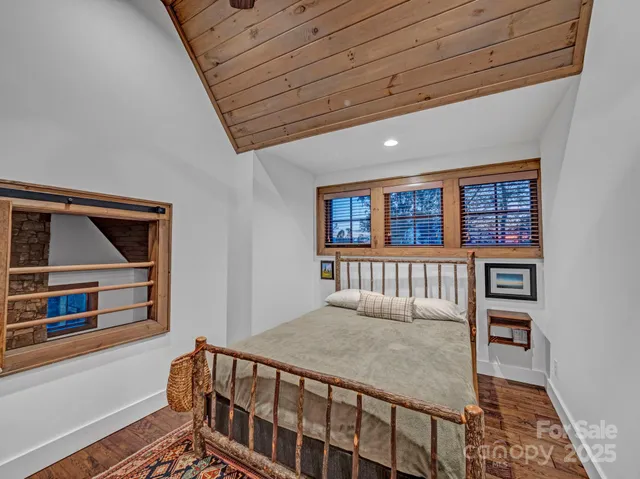 a bedroom with furniture and a window