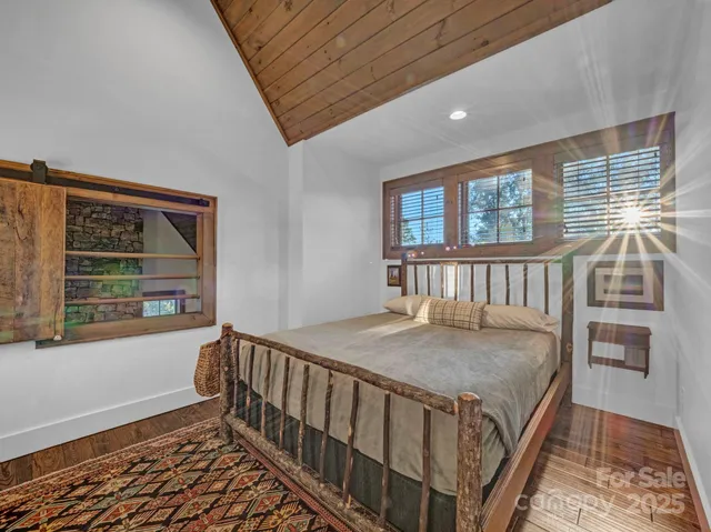 a bedroom with furniture and a window