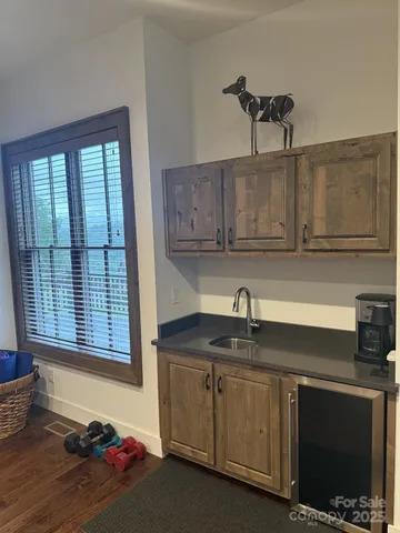 a kitchen with wooden cabinets and a sink