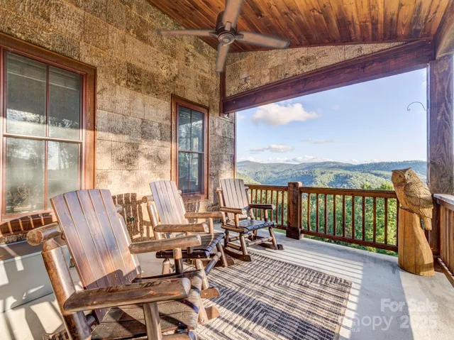 a view of balcony with furniture and floor to ceiling window