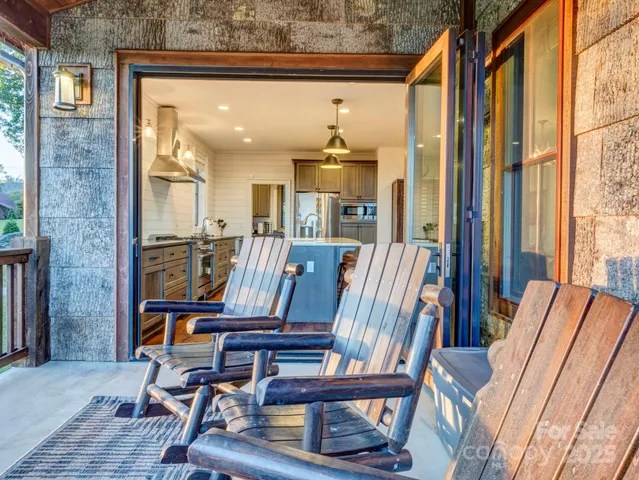 a view of a hallway with furniture and front door
