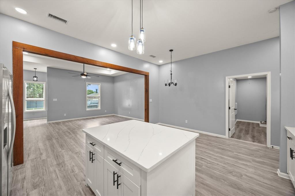 9469 Lakeland Loop Quinlan, TX 75474 - Photo 13 of 31 a kitchen with a wooden floor and entryway