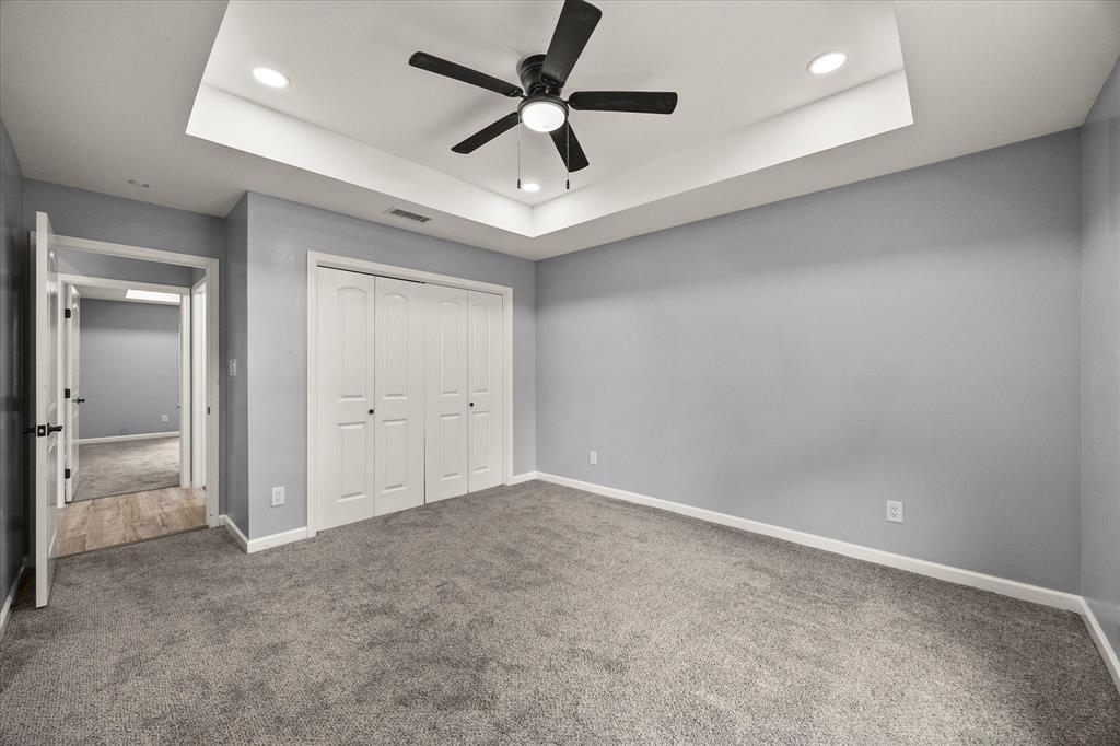 9469 Lakeland Loop Quinlan, TX 75474 - Photo 21 of 31 wooden floor in an empty room and a ceiling fan