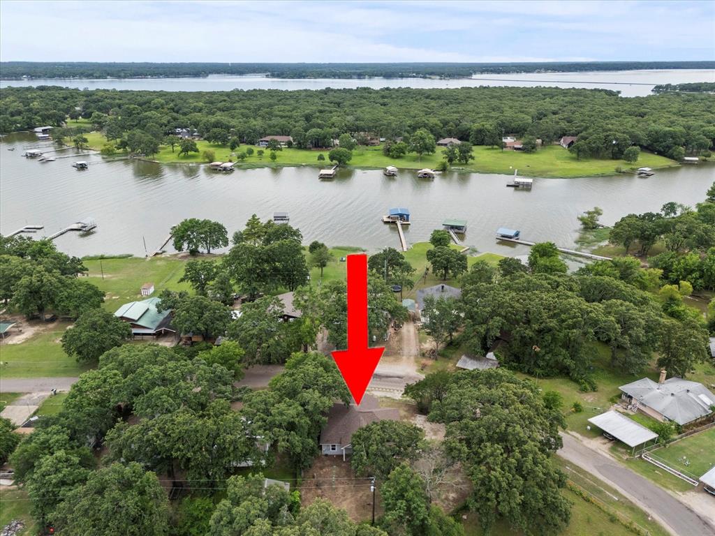 9469 Lakeland Loop Quinlan, TX 75474 - Photo 31 of 31 an aerial view of a houses with outdoor space and a lake view