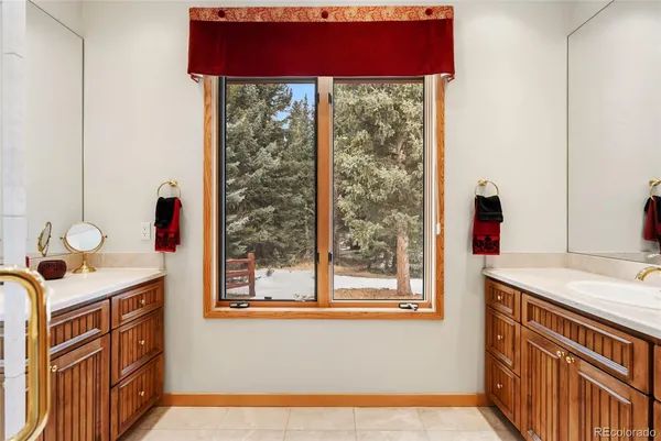 a bathroom with a sink and a window