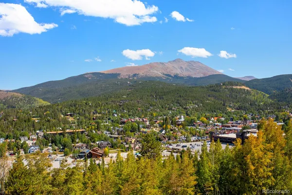 a view of a city with mountains in the background