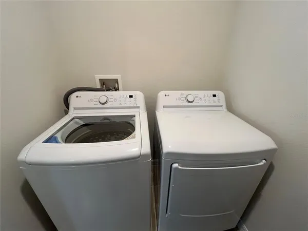 a bed sitting in a bedroom next to a bathroom