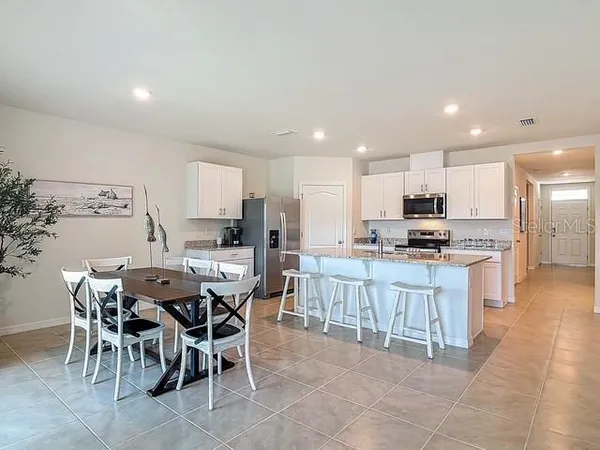 a large kitchen with dining room