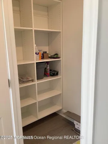 a view of an empty walk in closet