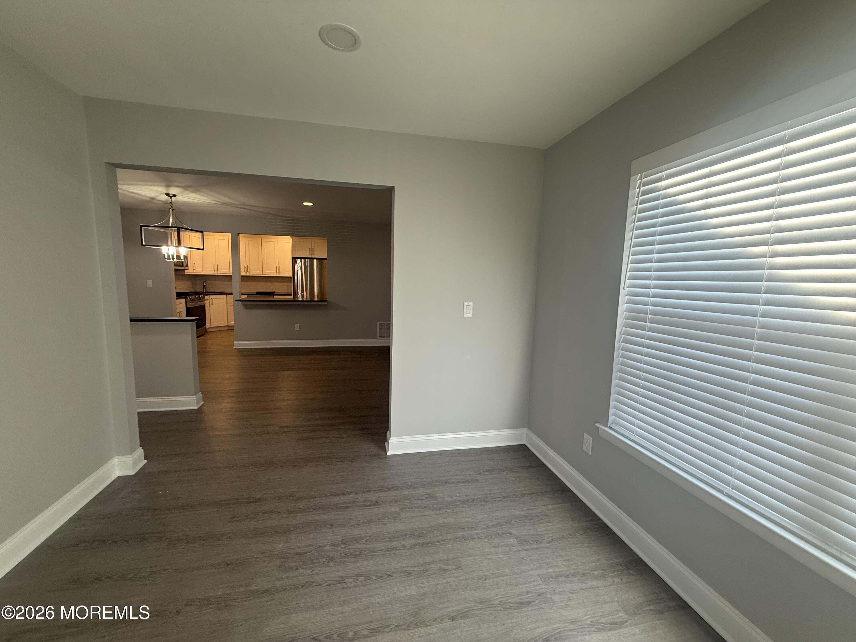 506 Harding Road, Unit 6 Freehold, NJ 07728 - Photo 22 of 31 a view of empty room with wooden floor