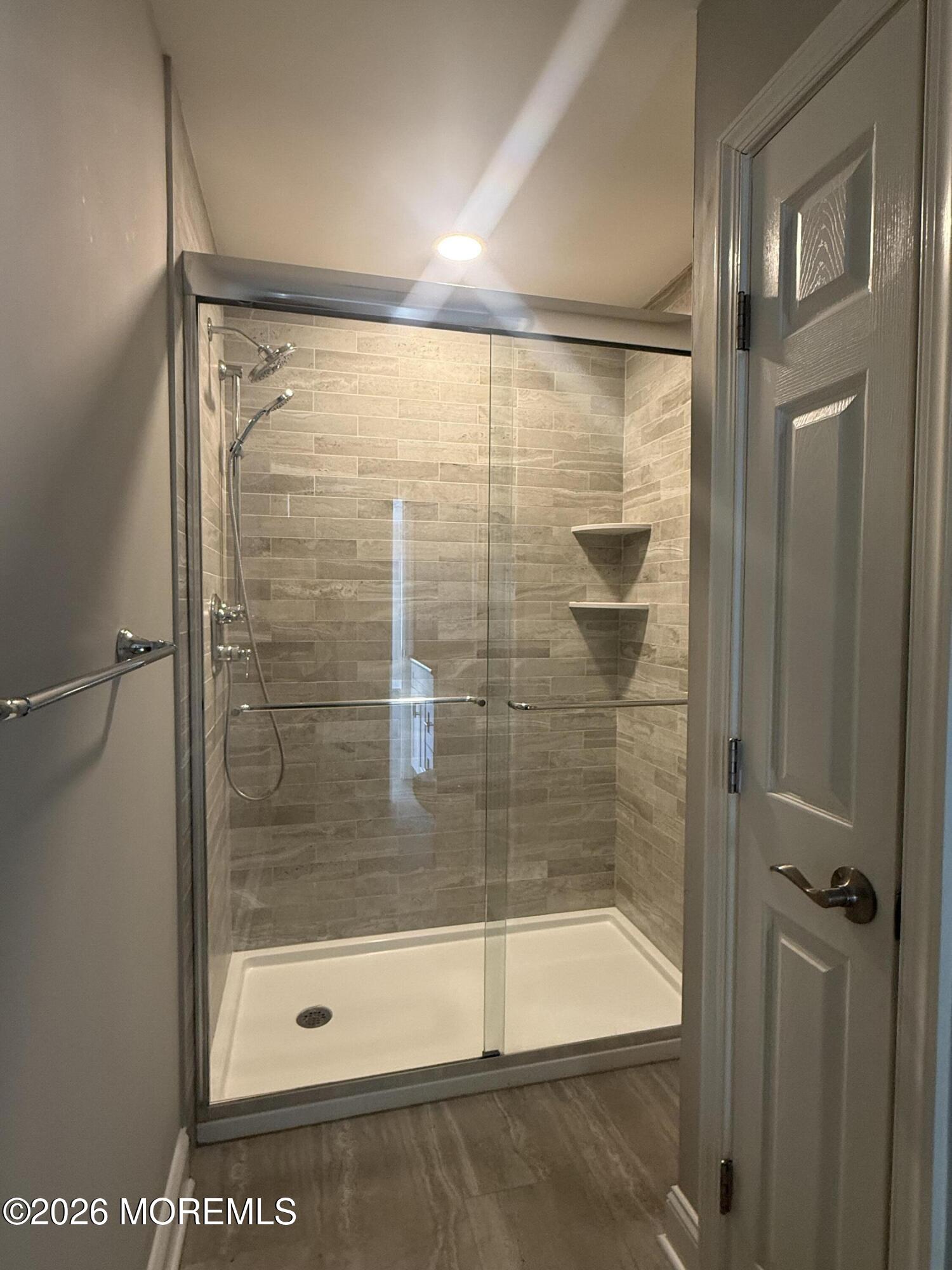 506 Harding Road, Unit 6 Freehold, NJ 07728 - Photo 26 of 31 a bathroom with a glass shower door