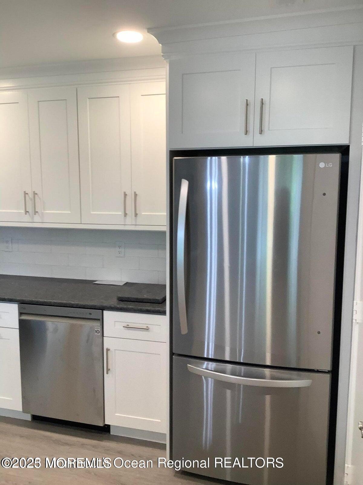 506 Harding Road, Unit 6 Freehold, NJ 07728 - Photo 3 of 21 a view of kitchen with stainless steel appliances granite countertop a refrigerator and a sink