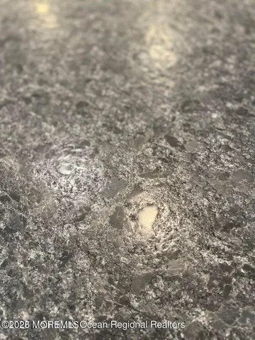 a close up of a white marble wall