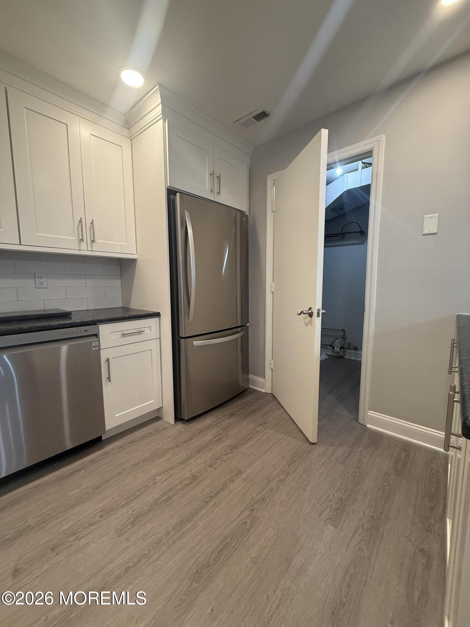506 Harding Road, Unit 6 Freehold, NJ 07728 - Photo 10 of 31 a kitchen with a refrigerator and a sink
