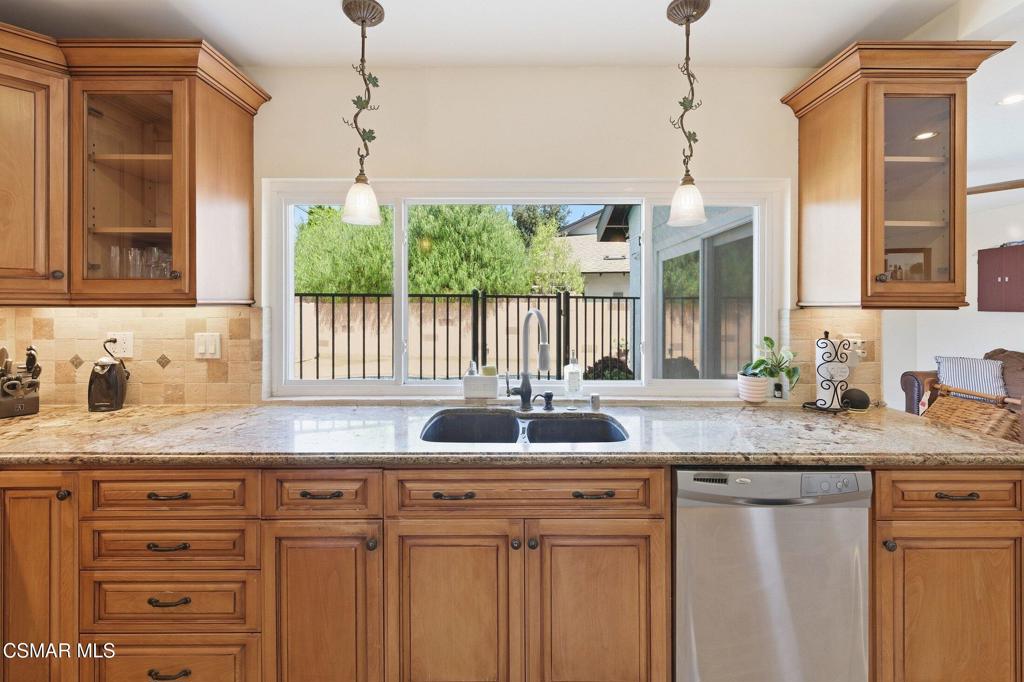 1837 Marcella Street Simi Valley, CA 93065 - Photo 17 of 66 a kitchen with granite countertop a sink and a window