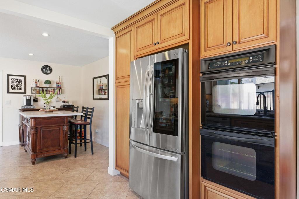 1837 Marcella Street Simi Valley, CA 93065 - Photo 20 of 66 a kitchen with stainless steel appliances granite countertop a stove and a refrigerator