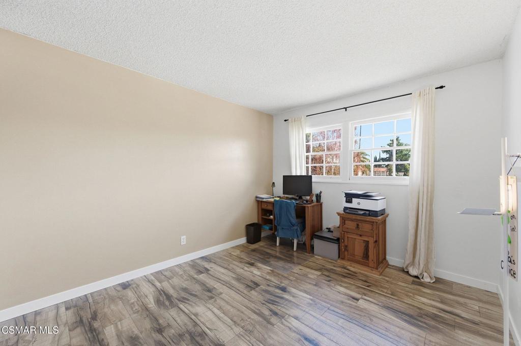 1837 Marcella Street Simi Valley, CA 93065 - Photo 32 of 66 a view of a workspace with furniture and a window