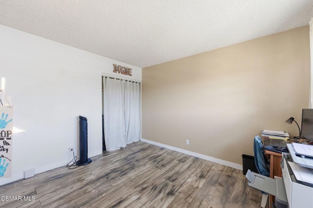 1837 Marcella Street Simi Valley, CA 93065 - Photo 34 of 66 a view of a room with wooden floor and white walls