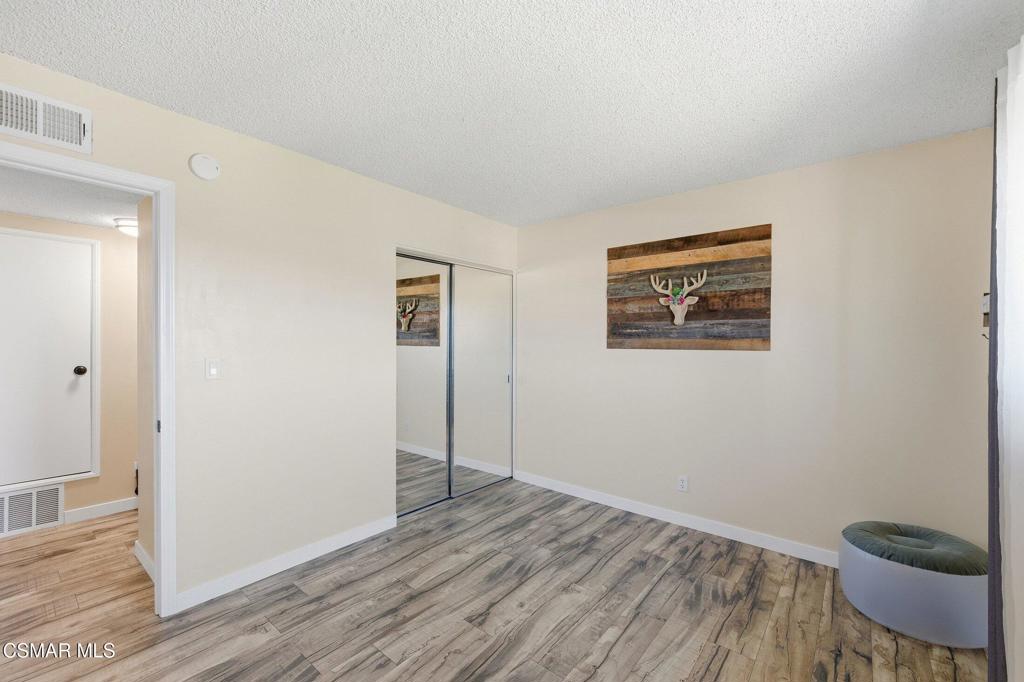 1837 Marcella Street Simi Valley, CA 93065 - Photo 38 of 66 an empty room with wooden floor and a window