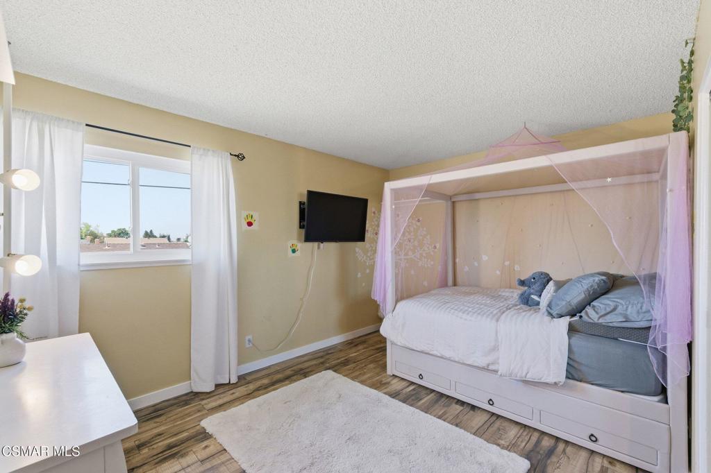 1837 Marcella Street Simi Valley, CA 93065 - Photo 40 of 66 a bedroom with a bed and a mirror