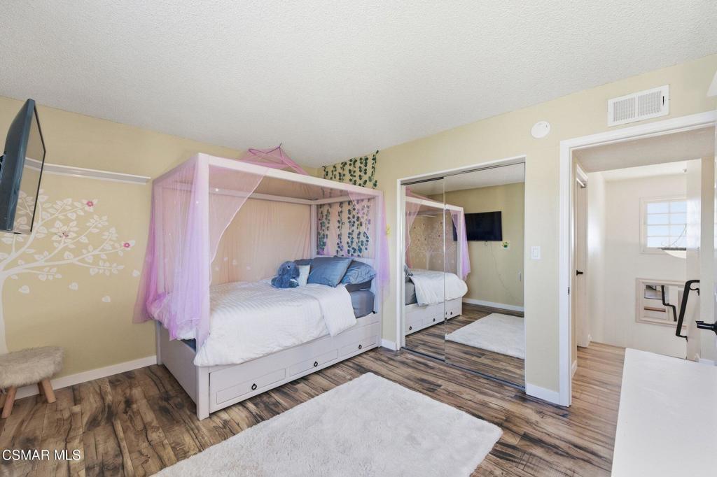 1837 Marcella Street Simi Valley, CA 93065 - Photo 41 of 66 a bedroom with a bed and a mirror