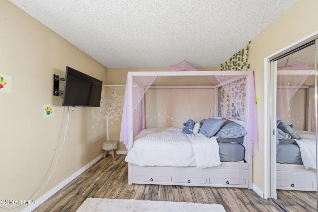 1837 Marcella Street Simi Valley, CA 93065 - Photo 42 of 66 a bedroom with a bed and a flat screen tv