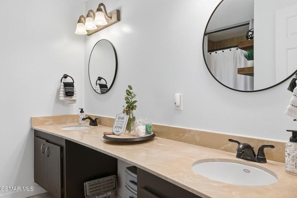 1837 Marcella Street Simi Valley, CA 93065 - Photo 43 of 66 a bathroom with a sink and a mirror