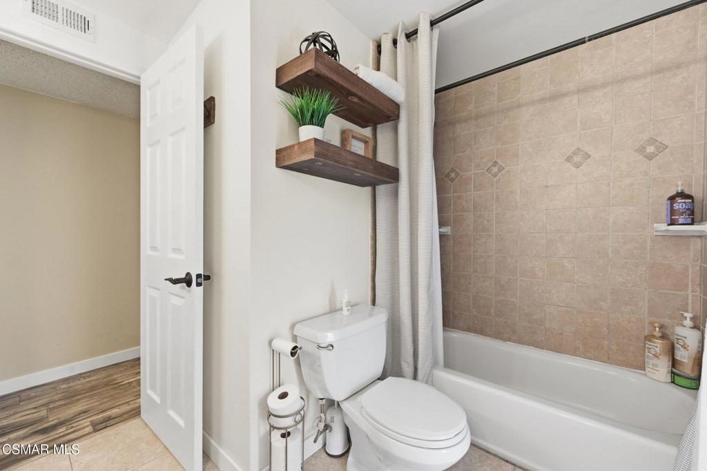 1837 Marcella Street Simi Valley, CA 93065 - Photo 46 of 66 a bathroom with a toilet and a shower