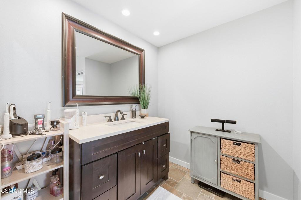1837 Marcella Street Simi Valley, CA 93065 - Photo 50 of 66 a bathroom with a sink and a mirror