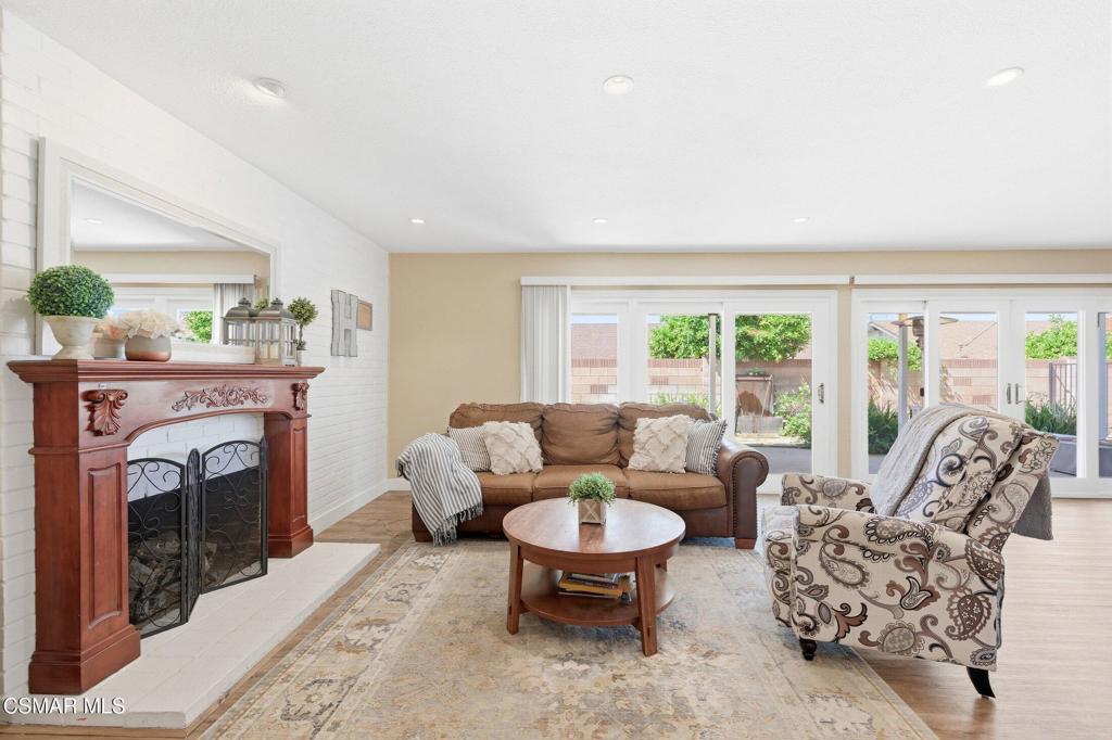 1837 Marcella Street Simi Valley, CA 93065 - Photo 5 of 66 a living room with furniture a large window and a fireplace