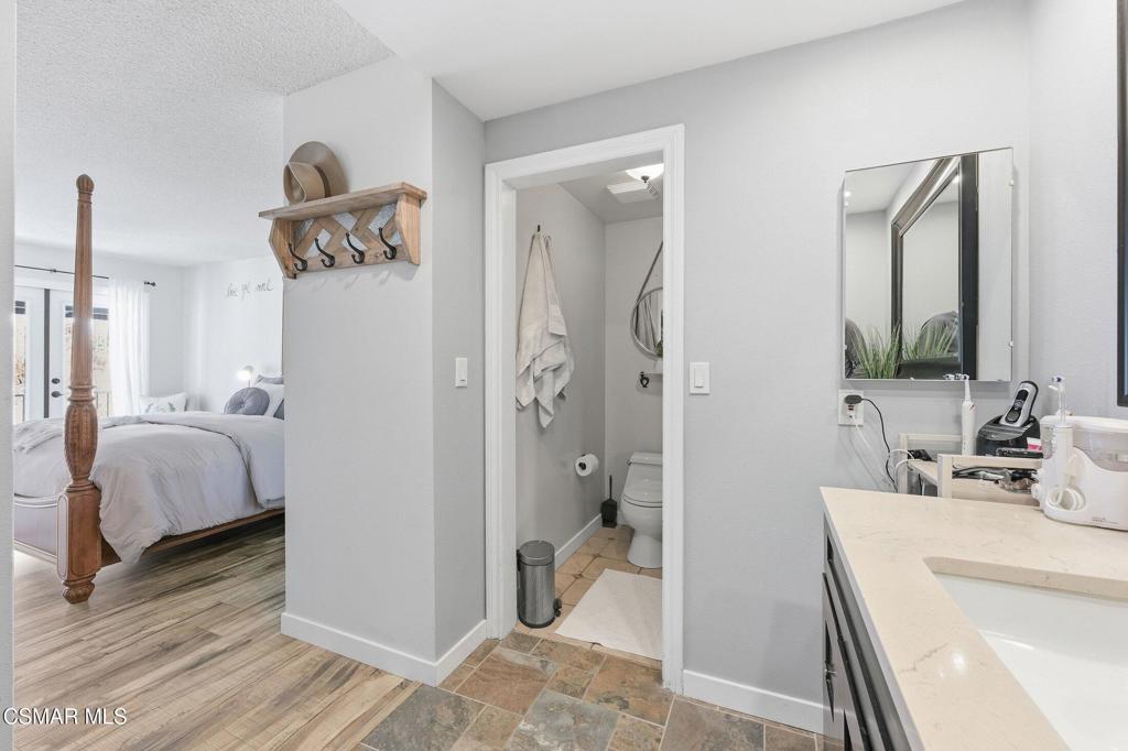 1837 Marcella Street Simi Valley, CA 93065 - Photo 51 of 66 a en suite bathroom with a double vanity sink and a mirror