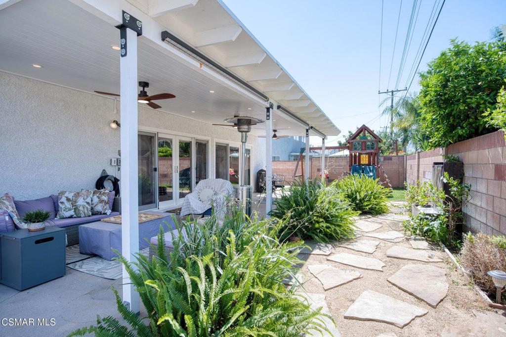 1837 Marcella Street Simi Valley, CA 93065 - Photo 61 of 66 a view of a patio with plants and chairs potted plants