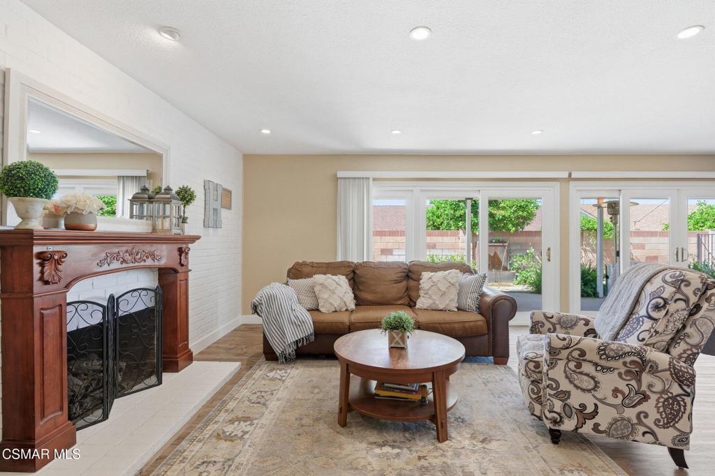 1837 Marcella Street Simi Valley, CA 93065 - Photo 8 of 66 a living room with furniture a fireplace and a large window