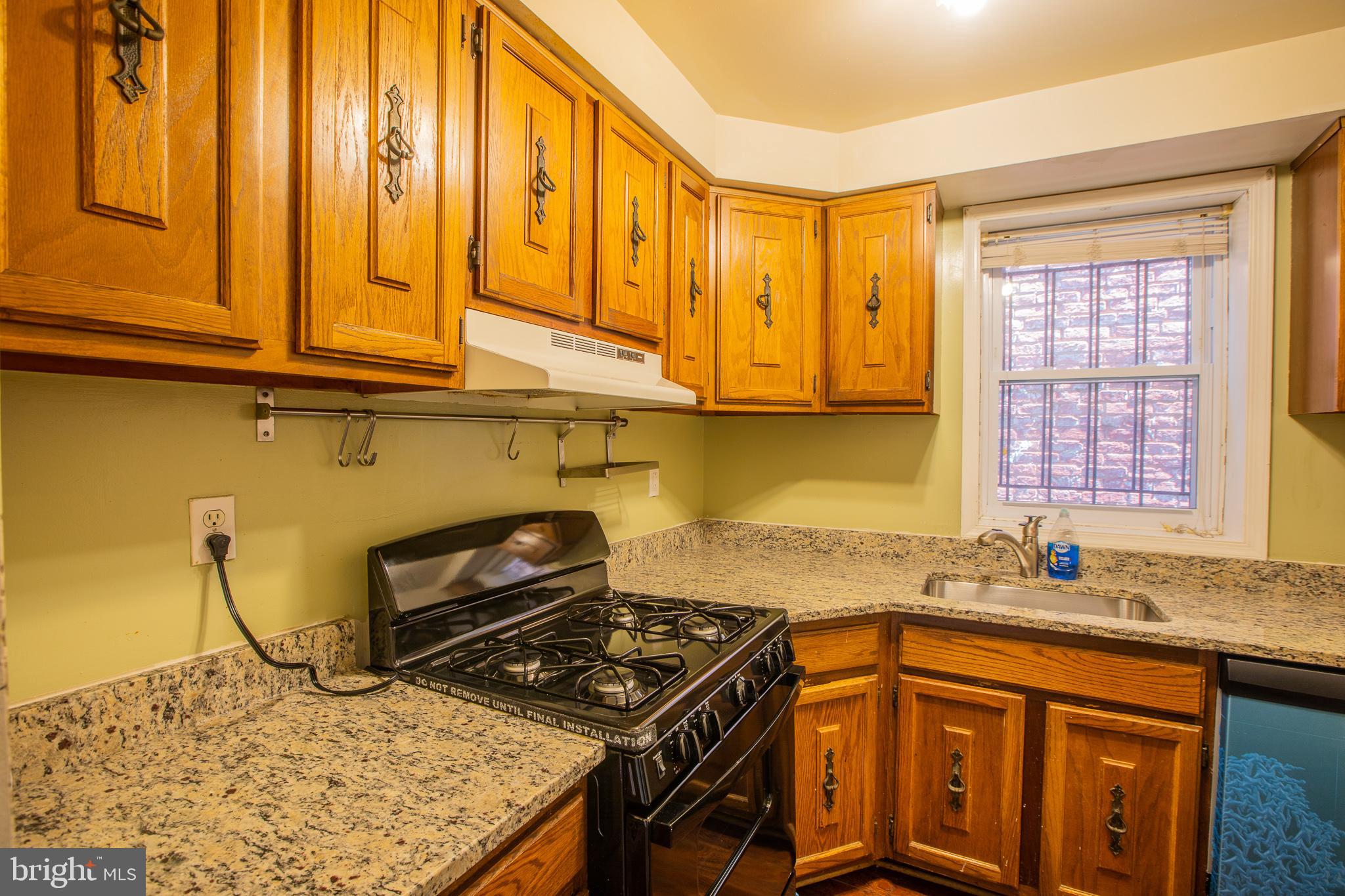 909 R Street Northwest, Unit B Washington, DC 20001 - Photo 12 of 17 a kitchen with a stove and a sink